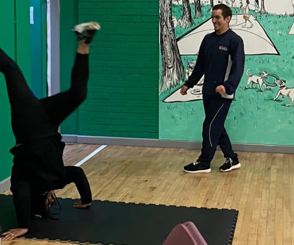 Adults spinning on head, breakdancing