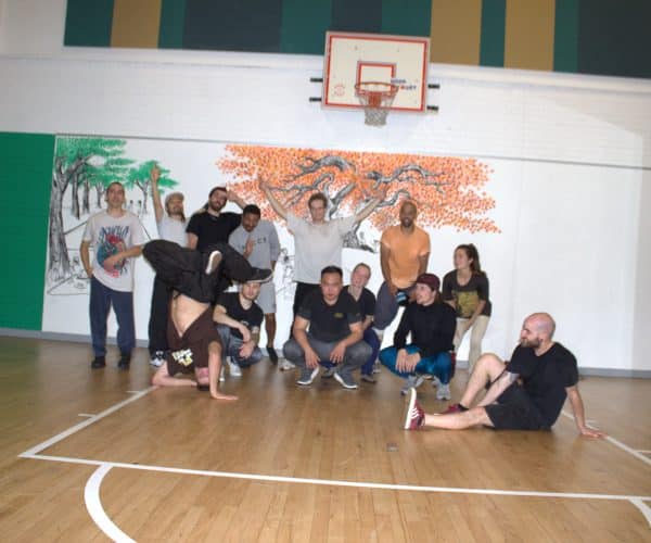 Adults breakdancing