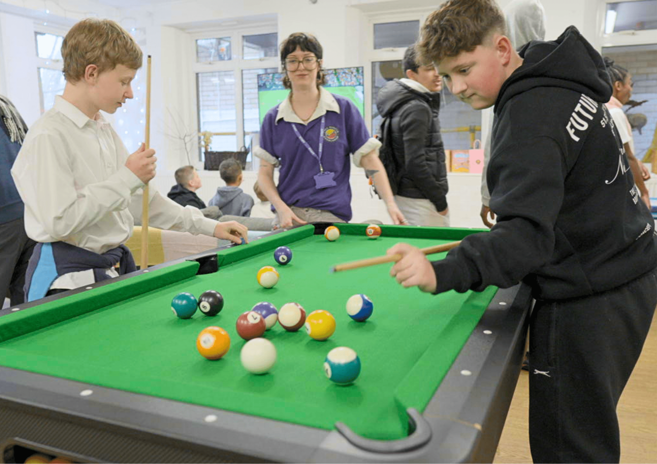 Teens playing snooker